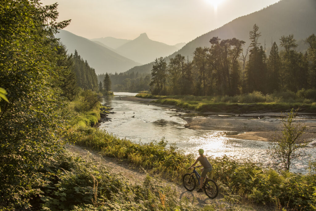 A cyclist on Slocan Valley Rail trail near Winlaw, BC.